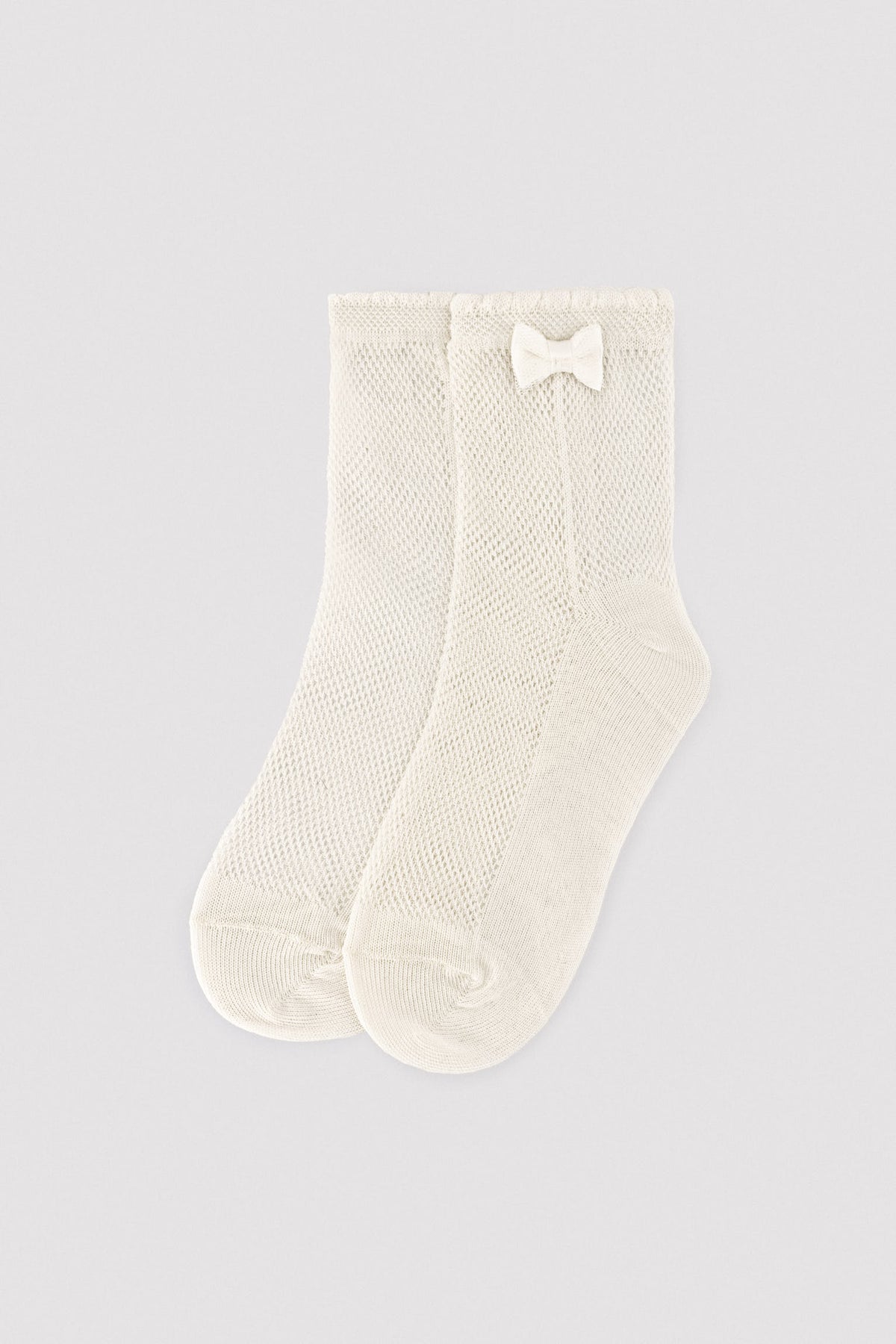 Calcetines infantiles calados detalle lazo marfil - Ysabel Mora