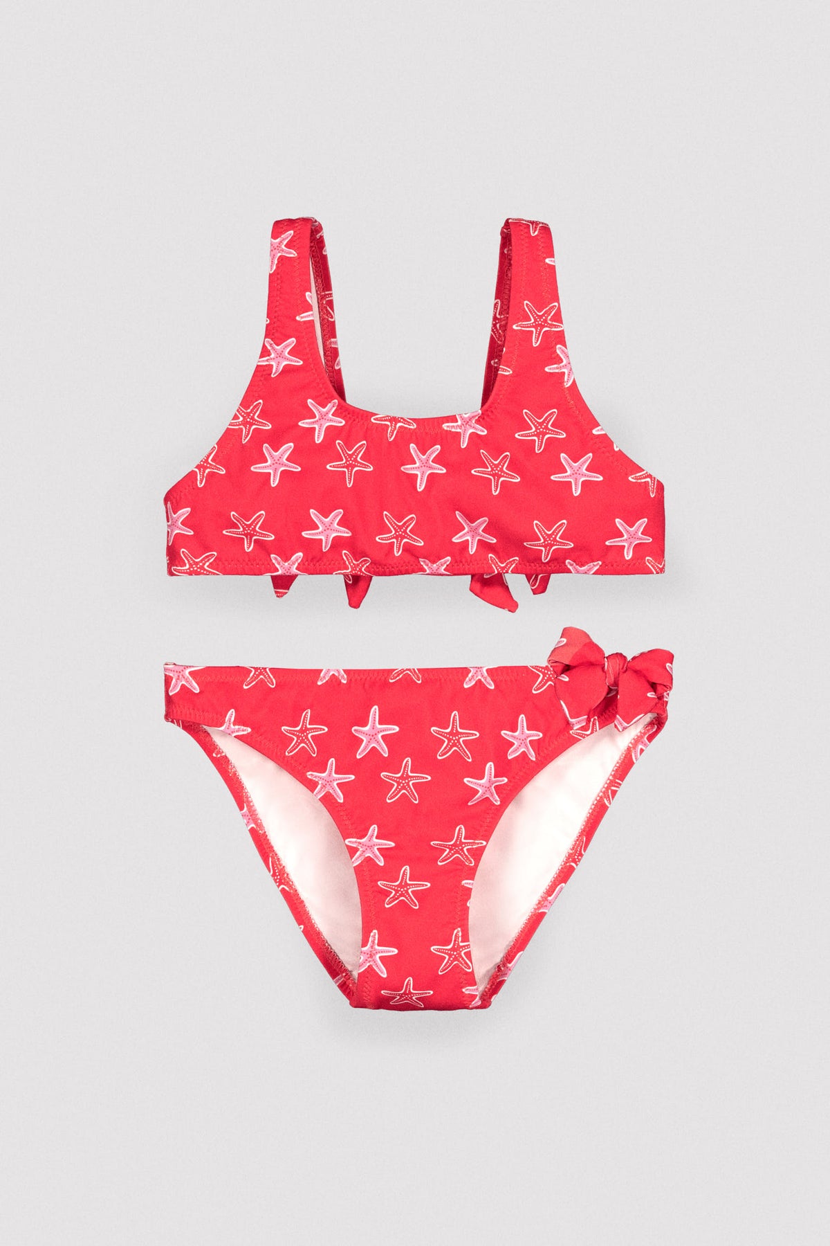 Bikini niña detalles volantes y lazos estampado estrellas marinas - Ysabel Mora