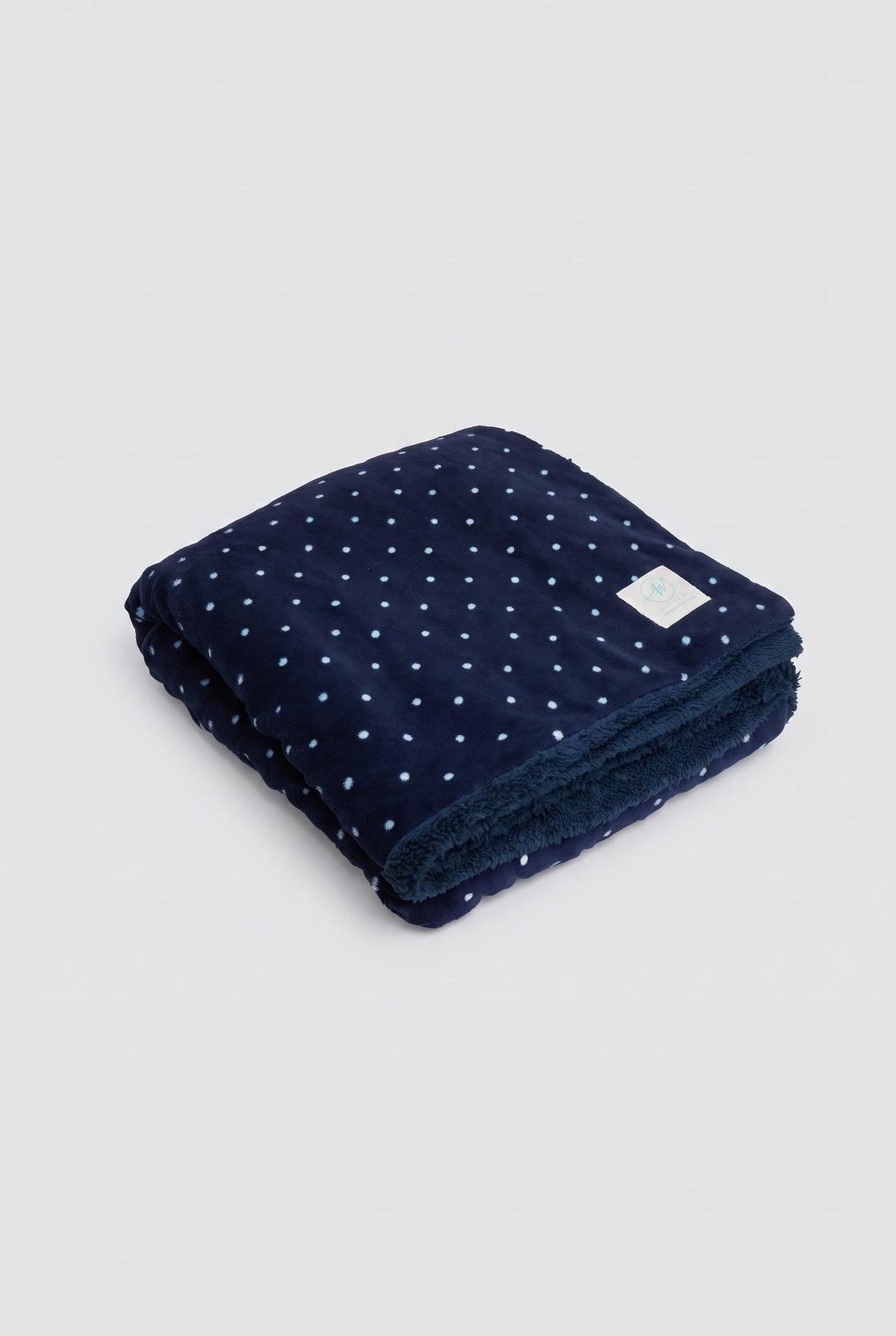 Plaid bleu marine à pois en polaire corail et effet mouton