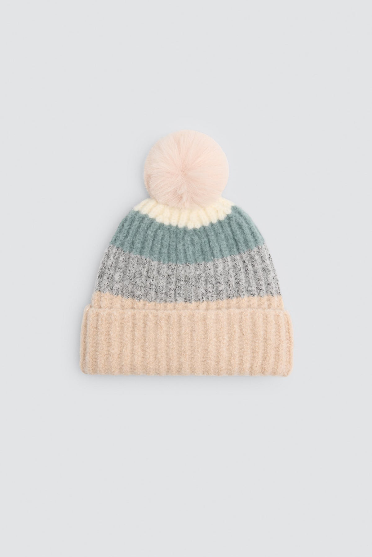 Bonnet en maille multicolore à pompon avec doublure polaire