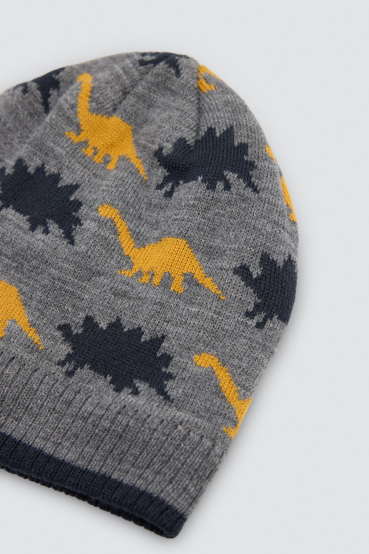 Bonnet garçon en maille imprimé dinosaures avec doublure polaire