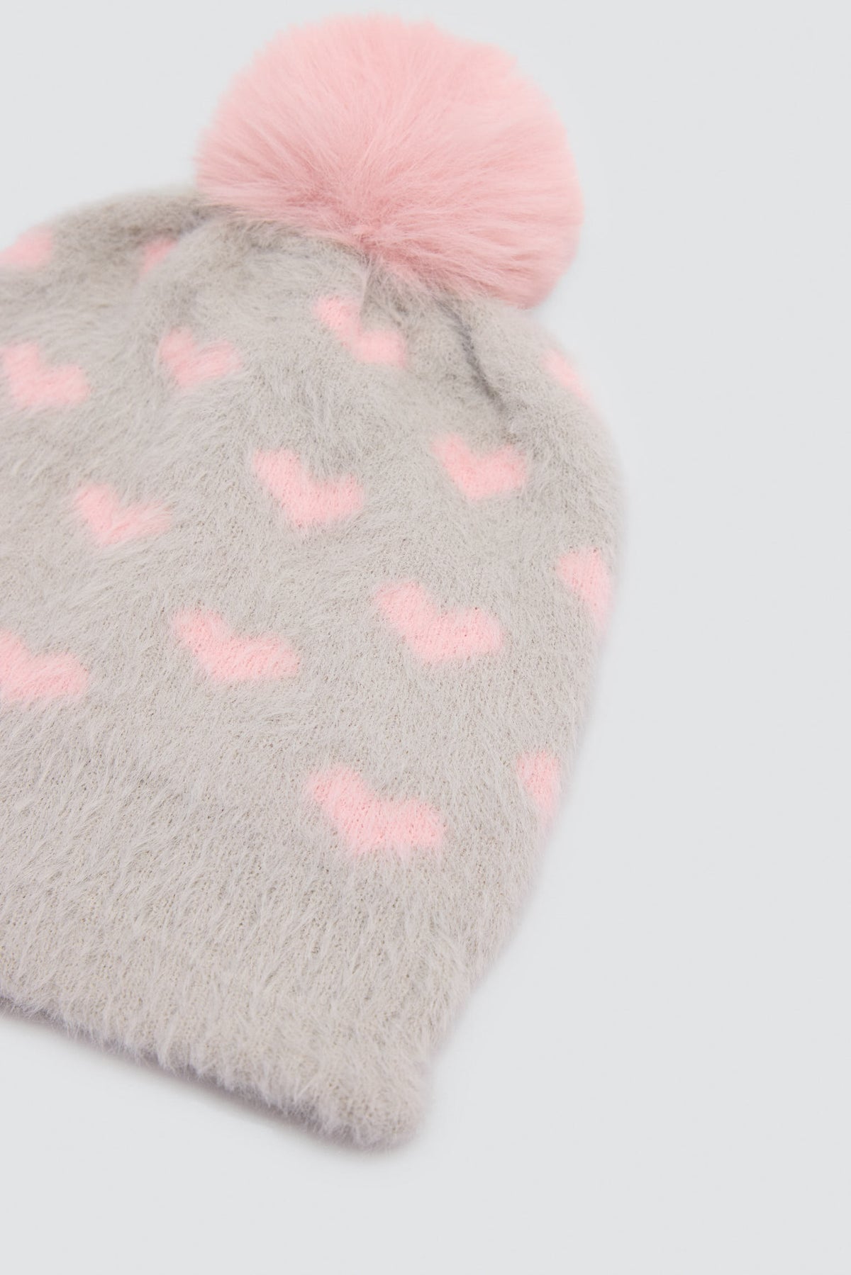 Bonnet fille à pompon avec doublure polaire et imprimé cœurs
