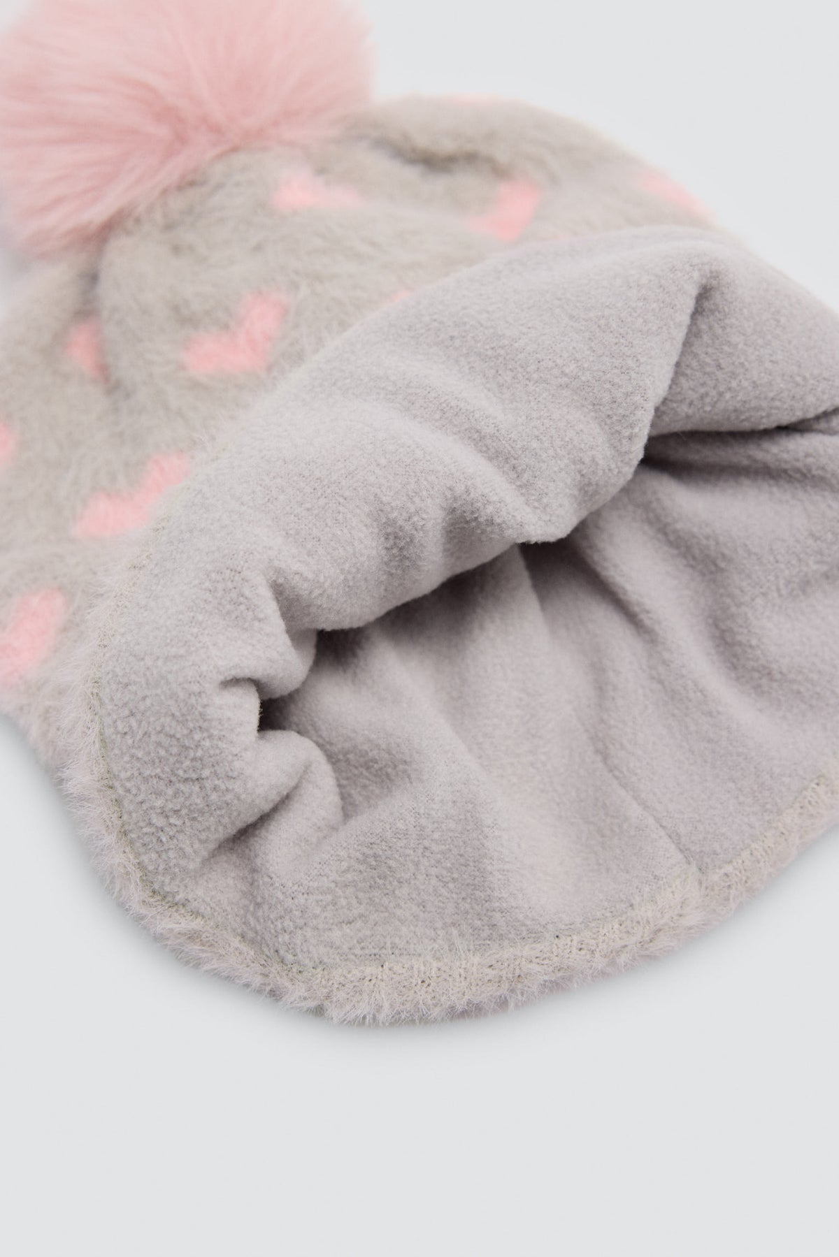 Bonnet fille à pompon avec doublure polaire et imprimé cœurs